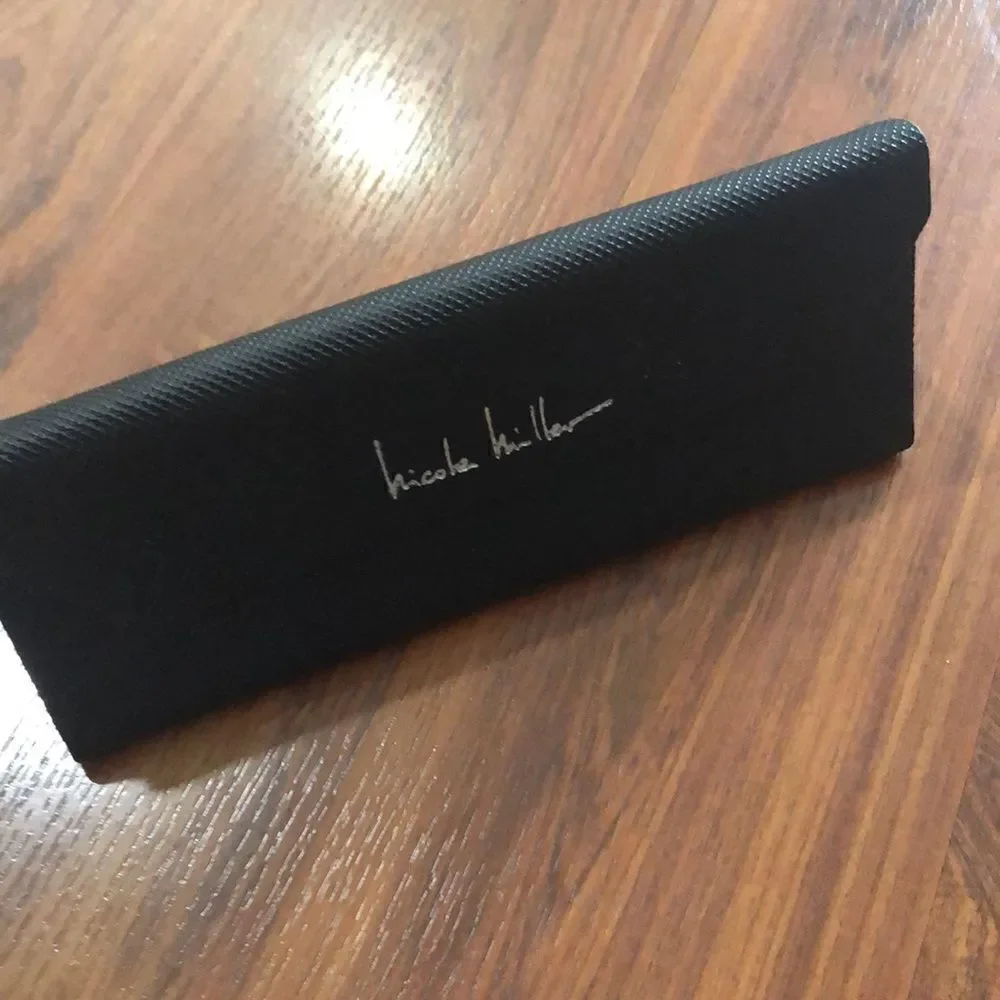 Nicole Miller Black hard triangular eyeglass case.